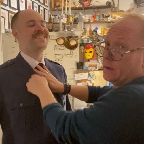 A Man of No Importance, Adam Sell and costumer David Alger adjusting the flower.